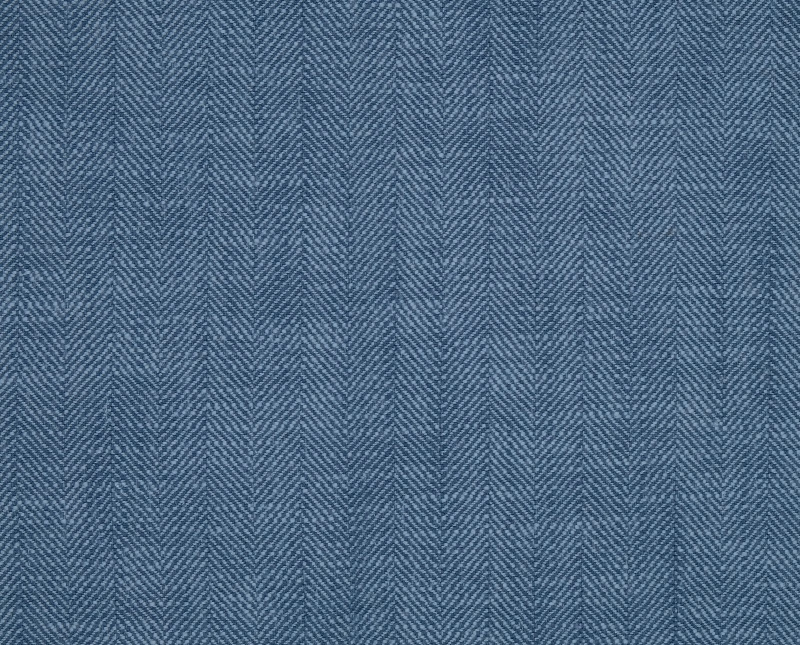 Blue herringbone chambray fabric swatch with fine woven texture