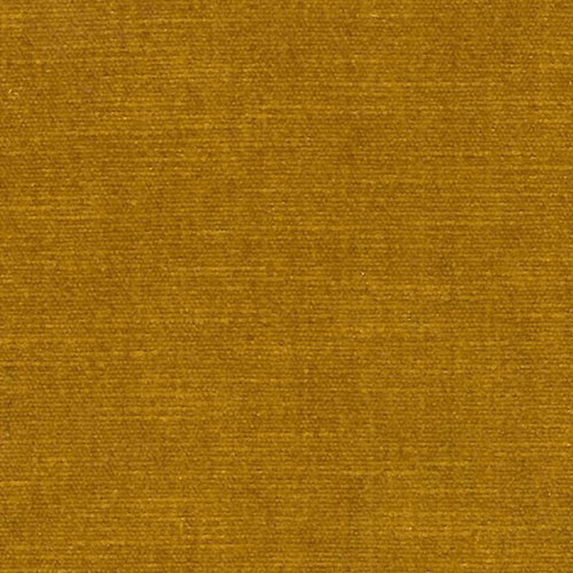 Close-up of warm honey-gold plain fabric with subtle woven texture