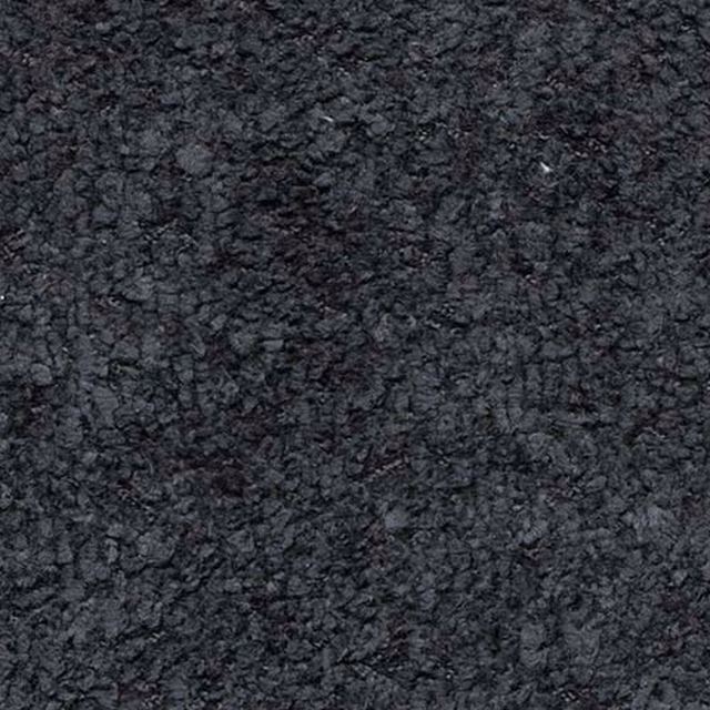 Close-up of a deep charcoal-black textured plain fabric with mottled highlights