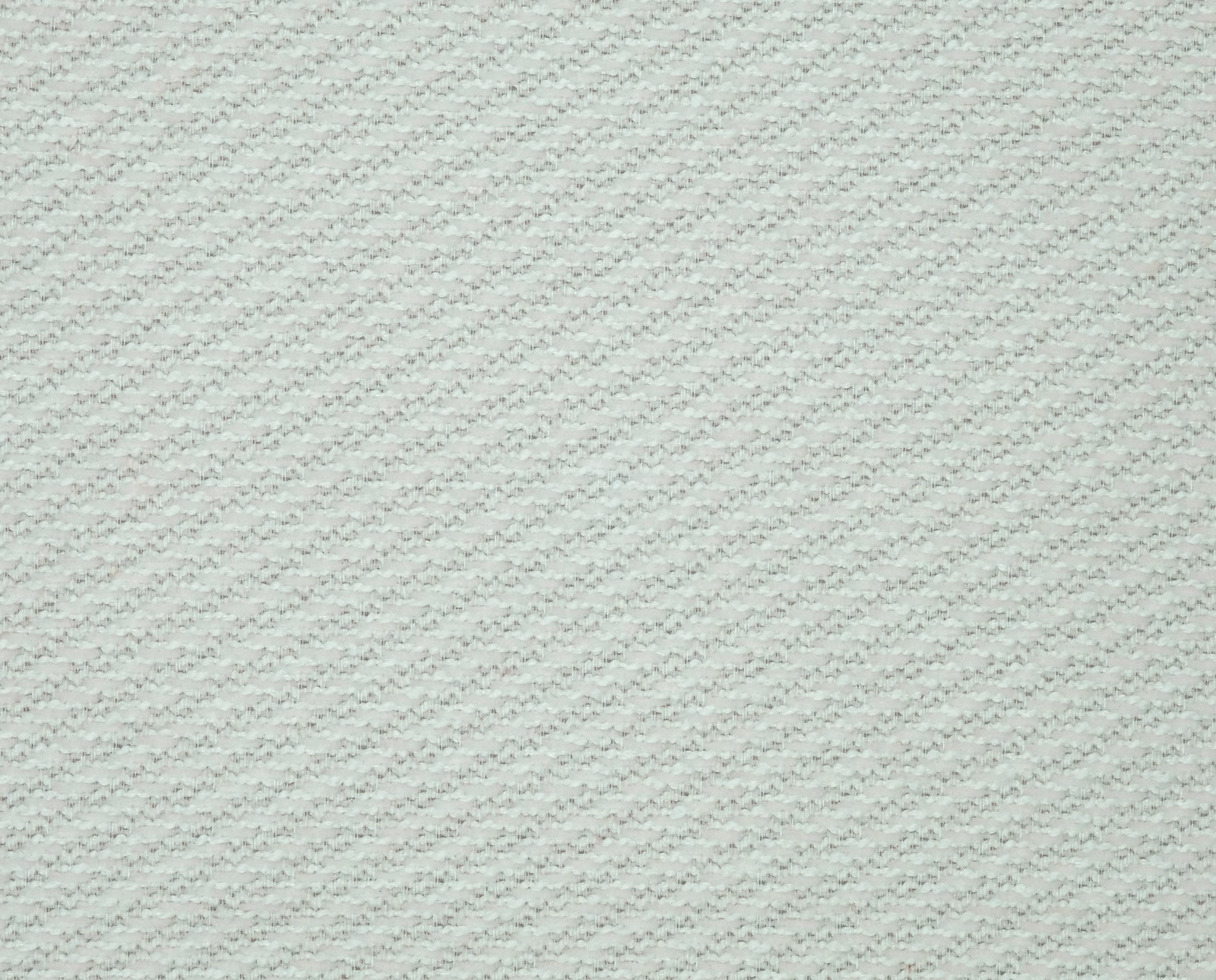 Pale pearl cream woven fabric with fine textured stitch-like surface