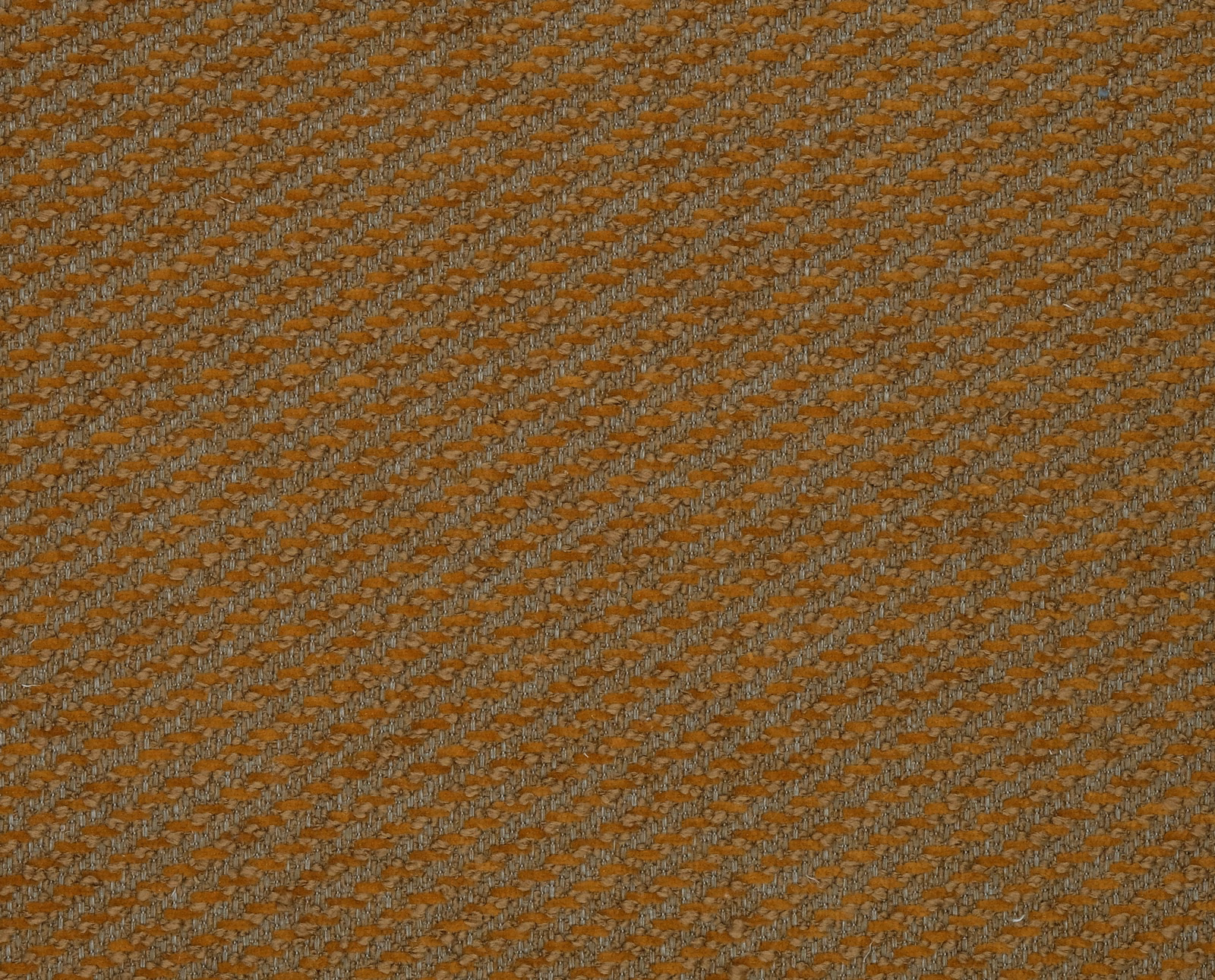 Close-up of rust orange woven fabric with fine diagonal texture