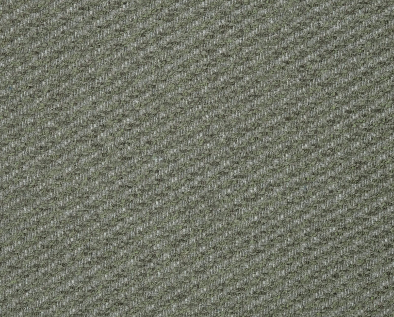 Close-up of a muted sage green woven fabric with fine diagonal texture
