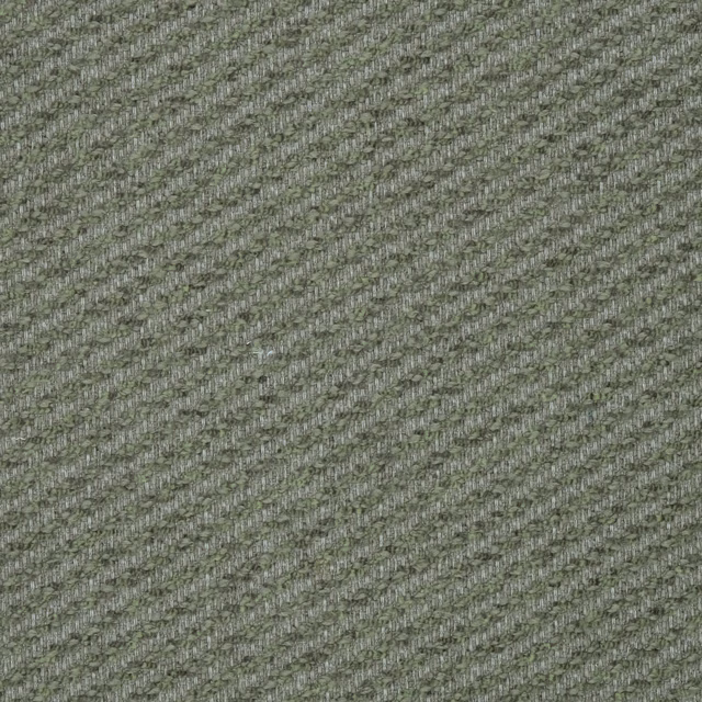Close-up of a muted sage green woven fabric with fine diagonal texture