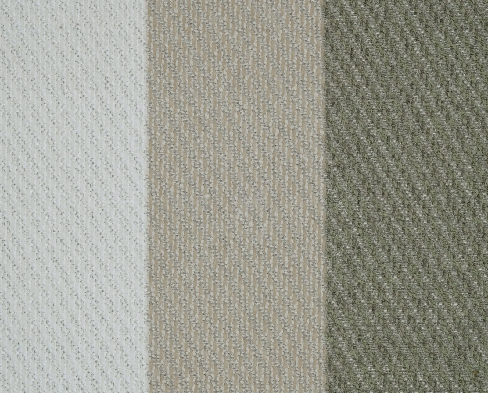Close-up of muted sage and stone vertical stripe woven fabric