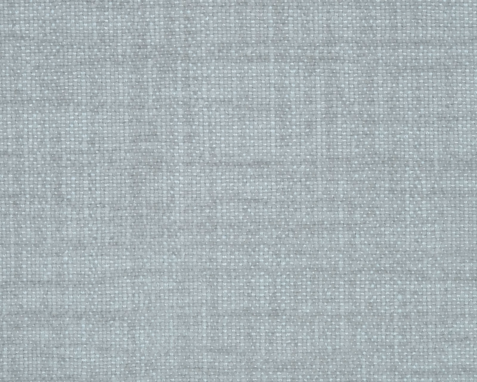 Close-up of a pale silver-grey plain woven fabric with fine texture