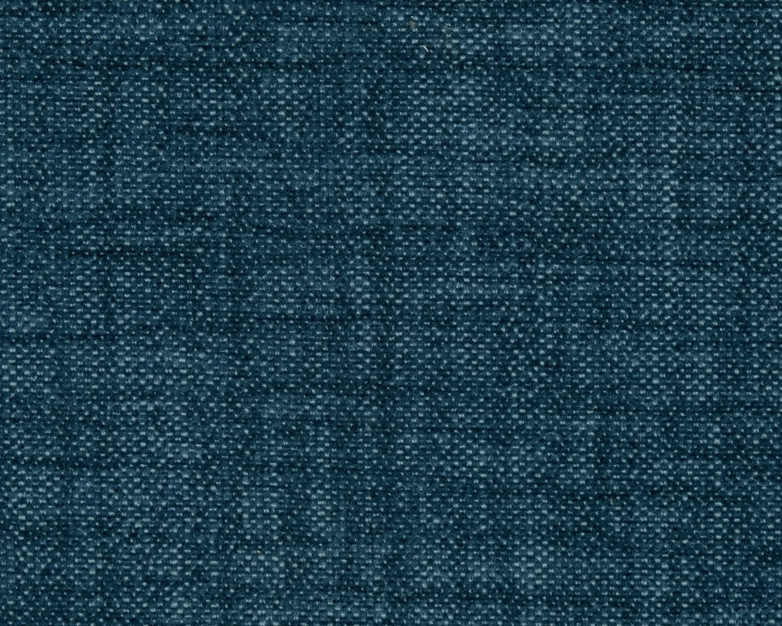 Close-up of a deep teal plain woven fabric with subtle flecked texture