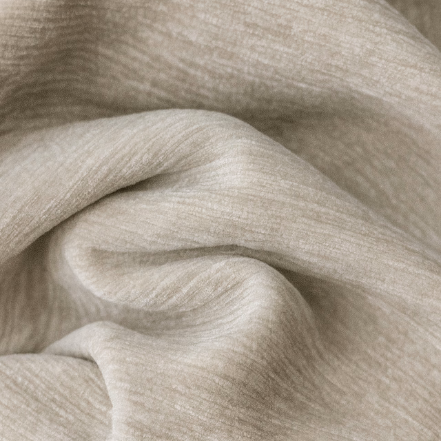 Soft dove-white plain woven fabric with gentle folded texture and subtle grey undertone