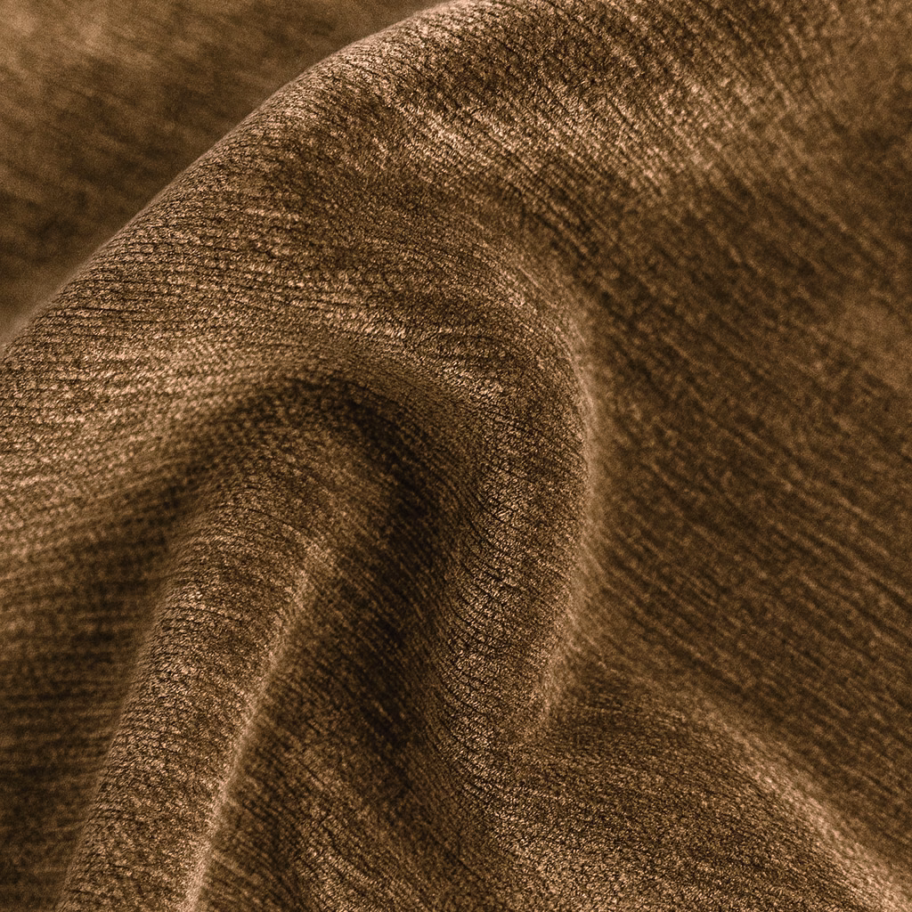 Close-up of warm pecan-brown plain upholstery fabric with a softly mottled weave