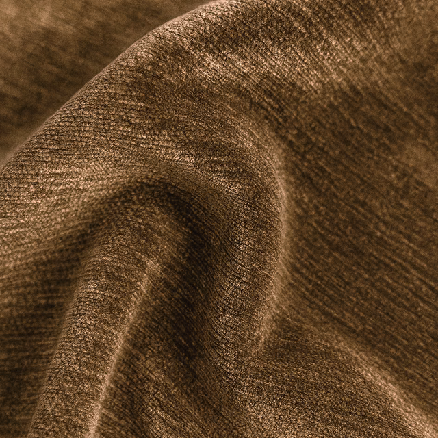 Close-up of warm pecan-brown plain upholstery fabric with a softly mottled weave