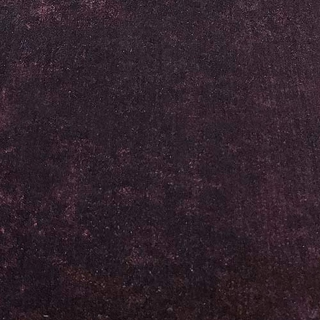 Close-up of dark aubergine plain fabric with a soft velvety texture