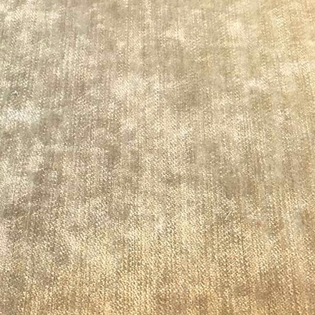 Warm beige plain fabric swatch with mottled, subtly striated texture