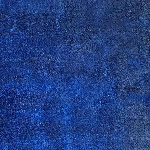 Close-up of deep blueberry blue plain fabric with a softly mottled texture