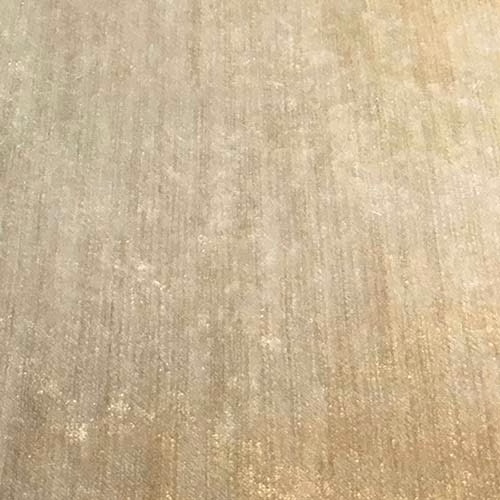 Close-up of a warm camel-beige plain fabric with subtle vertical striations and soft sheen