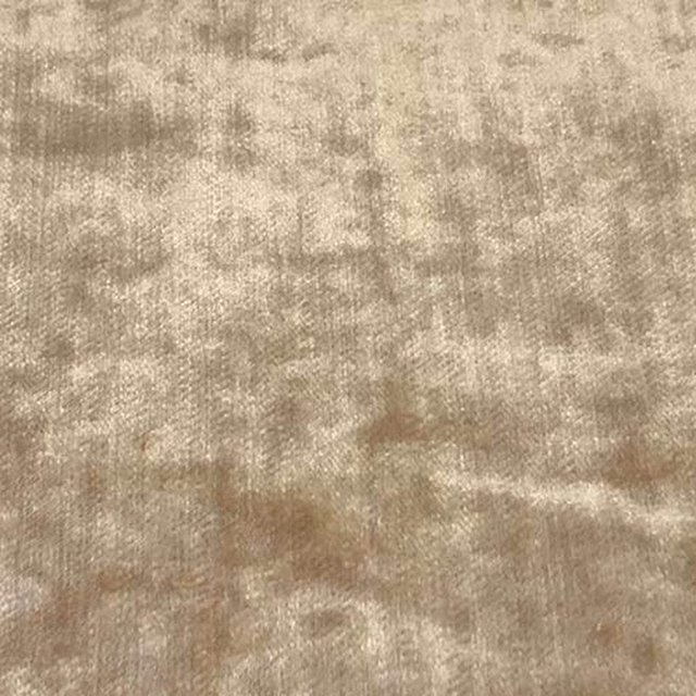 Warm caramel beige plain fabric swatch with a softly mottled, velvety surface
