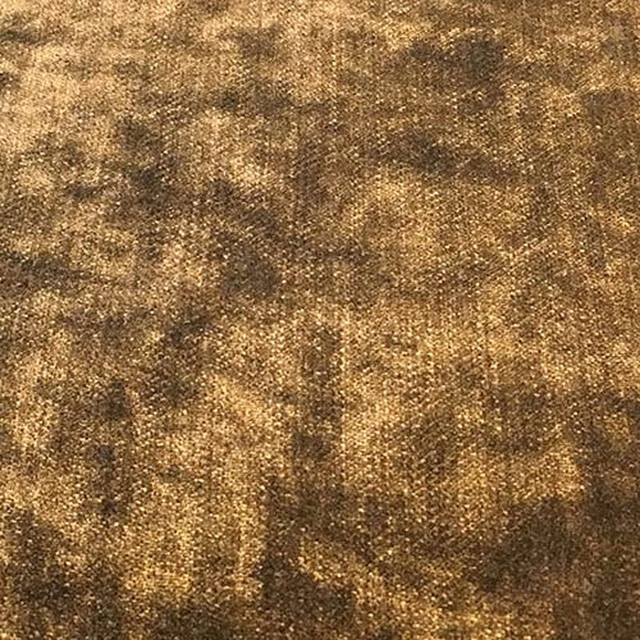Close-up of mottled chocolate-brown woven fabric with golden highlights