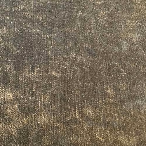 Close-up of warm olive-grey woven plain fabric with subtle speckled sheen