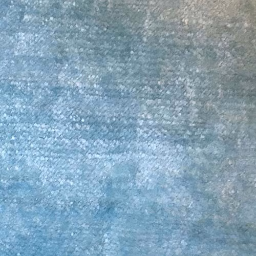 Soft mottled lagoon blue plain fabric with a cloudy, textured surface
