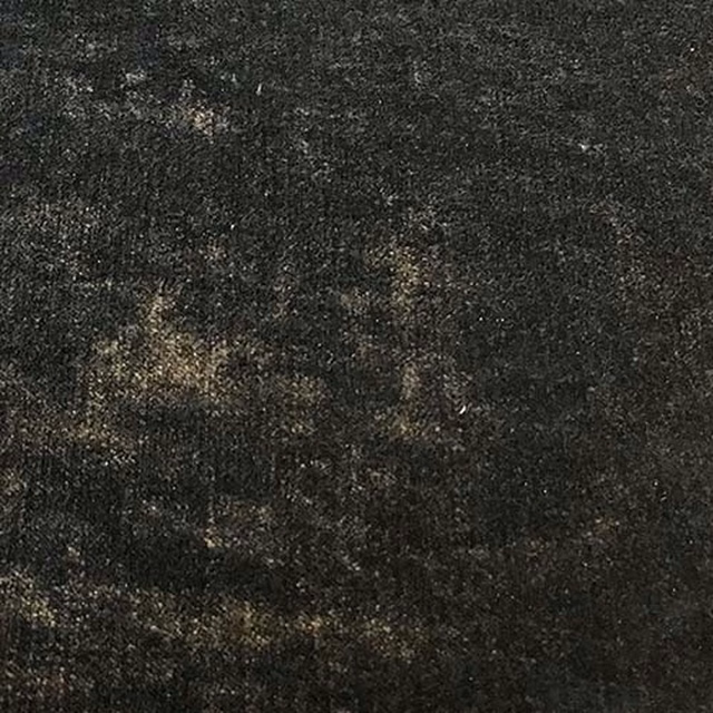 Close-up of a deep midnight black plain fabric with subtle mottled tonal flecks