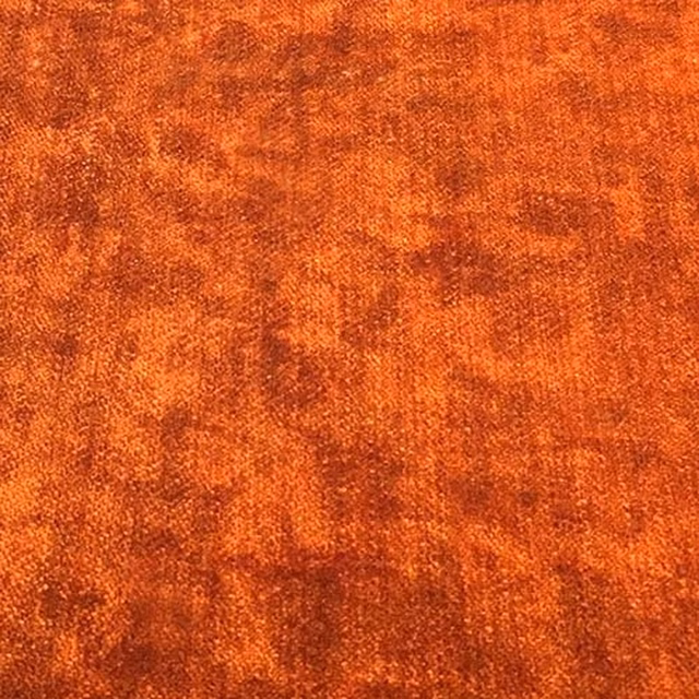 Mottled burnt orange plain fabric with a softly textured, heathered surface