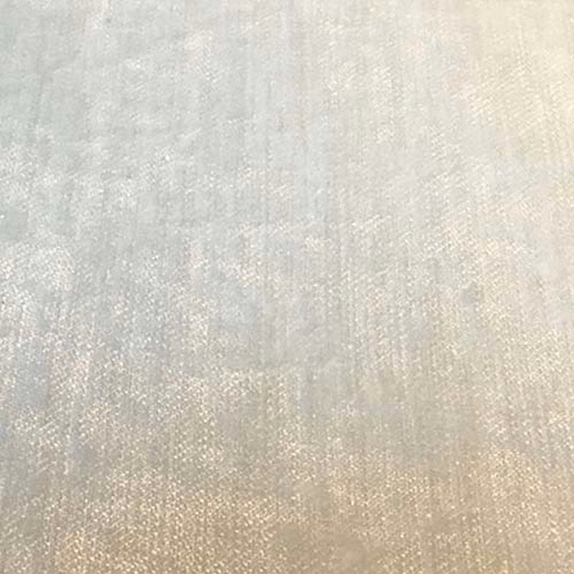 Close-up of pearl cream plain fabric with a soft woven sheen