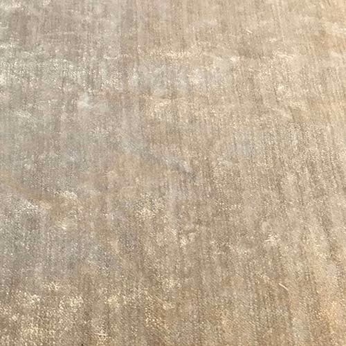 Close-up of Modena Pebble fabric in warm beige with subtle mottled sheen