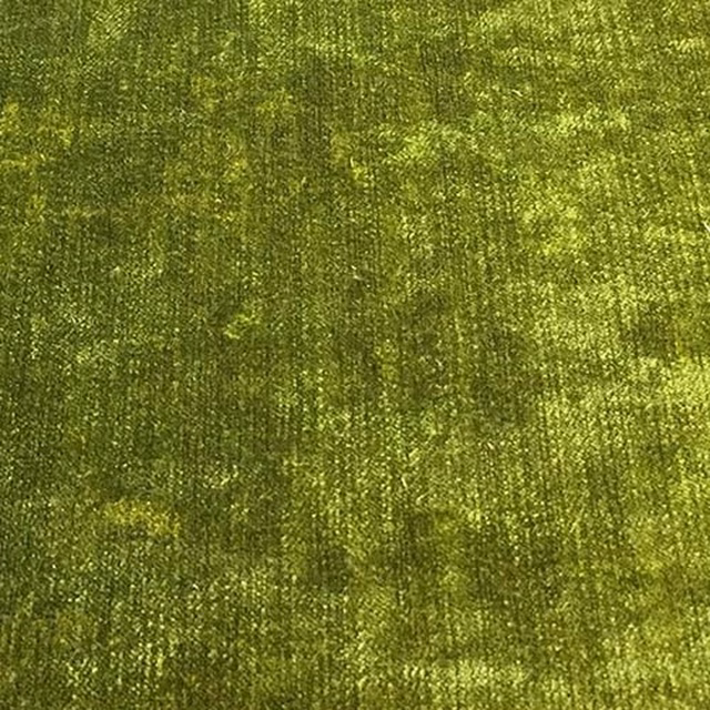 Bright pistachio green plain fabric with a softly mottled, light-catching texture