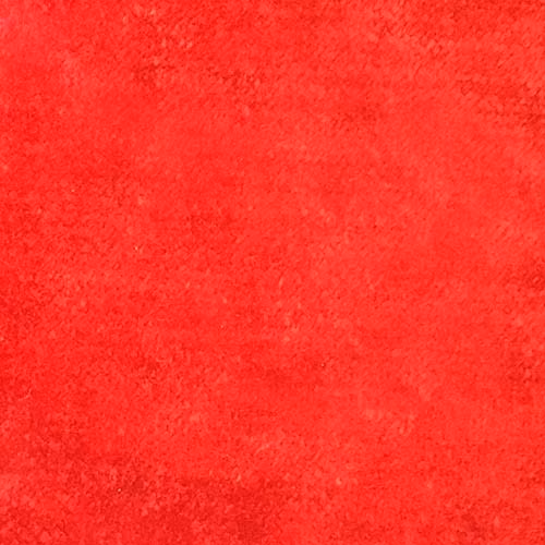 Close-up of bright cherry red plain fabric with a soft, velvety texture