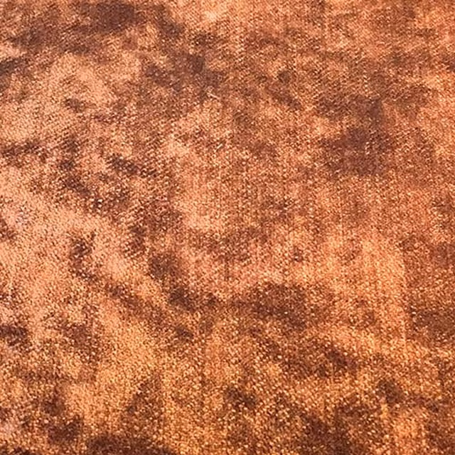 Mottled rust and copper plain weave fabric with warm brown shading
