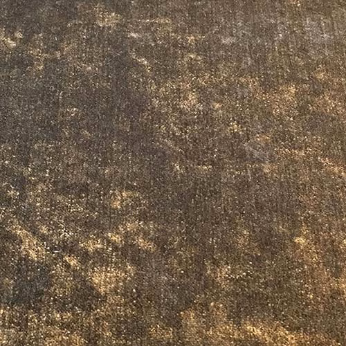Close-up of a deep truffle-brown plain fabric with golden mottled flecks and subtle texture.