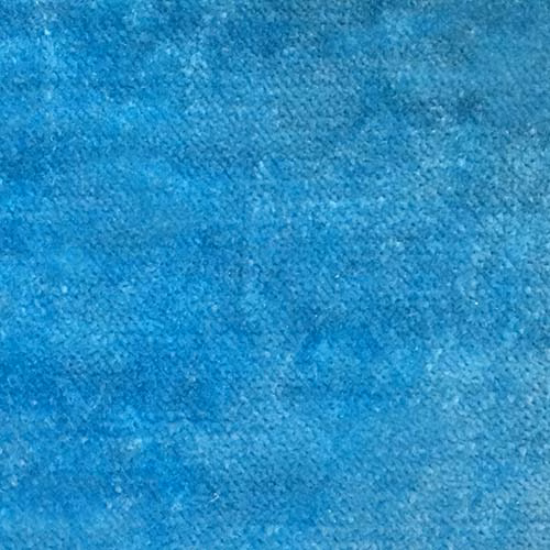 Close-up of bright turquoise blue plain upholstery fabric with a softly mottled texture