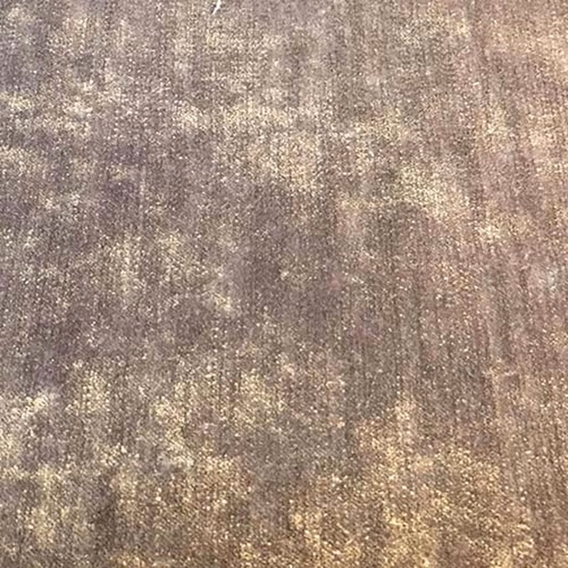 Muted violet plain fabric swatch with dusty taupe and beige tonal speckling