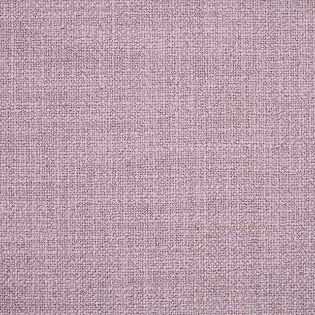 Close-up of a soft lavender plain weave fabric with fine textured surface