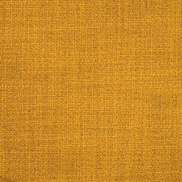 Close-up of a warm ochre-gold plain weave fabric with fine textured surface