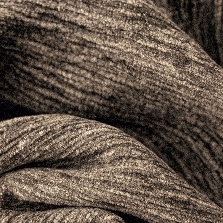 Close-up of a warm cappuccino brown plain woven fabric with subtle heathered texture