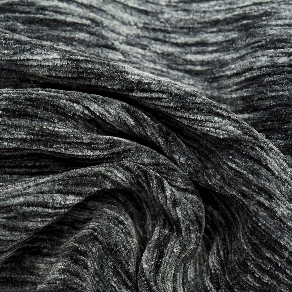 Close-up of charcoal grey crushed plain fabric with silver highlights