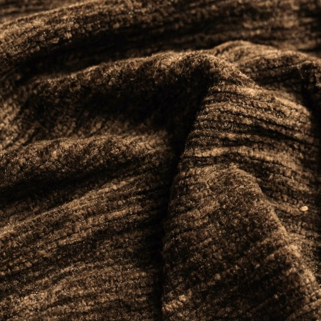 Close-up of deep cocoa-brown textured plain fabric with soft brushed ridges