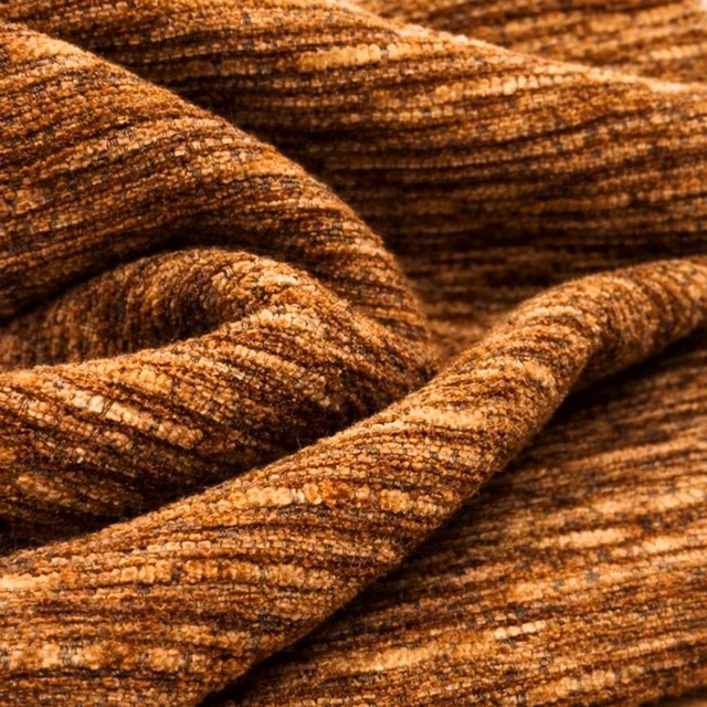 Close-up of rust-brown woven upholstery fabric with a textured, flecked surface