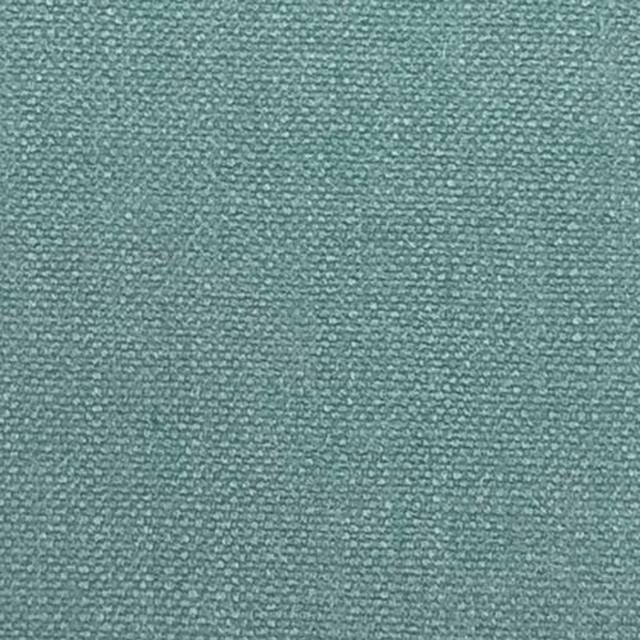 Close-up of a soft marine teal plain weave fabric with fine textured surface