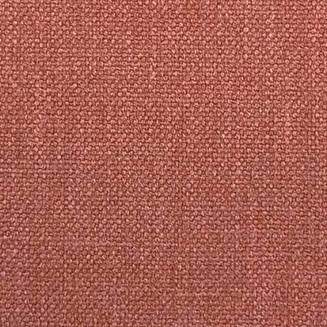 Close-up of a dusty strawberry-pink plain weave fabric with a fine textured surface