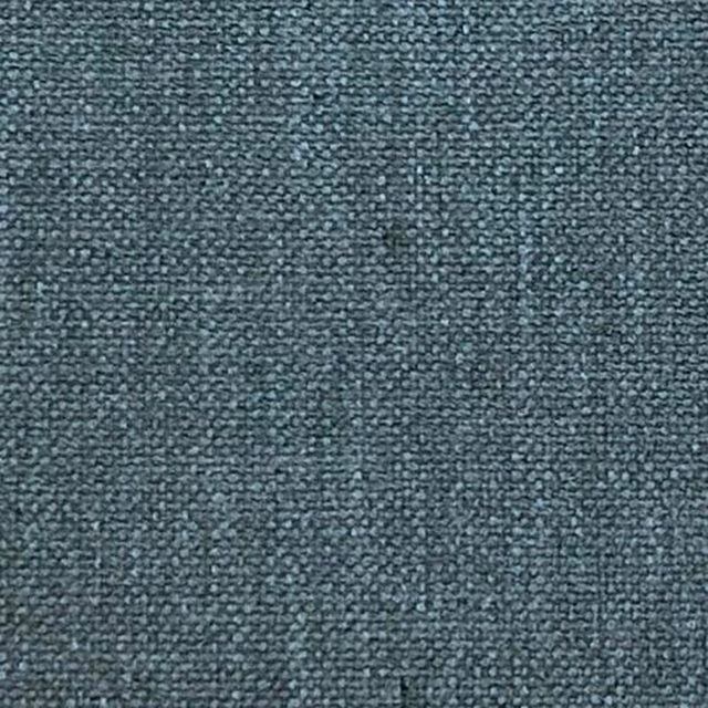 Close-up of a muted blue teal plain woven fabric with a fine nubby texture