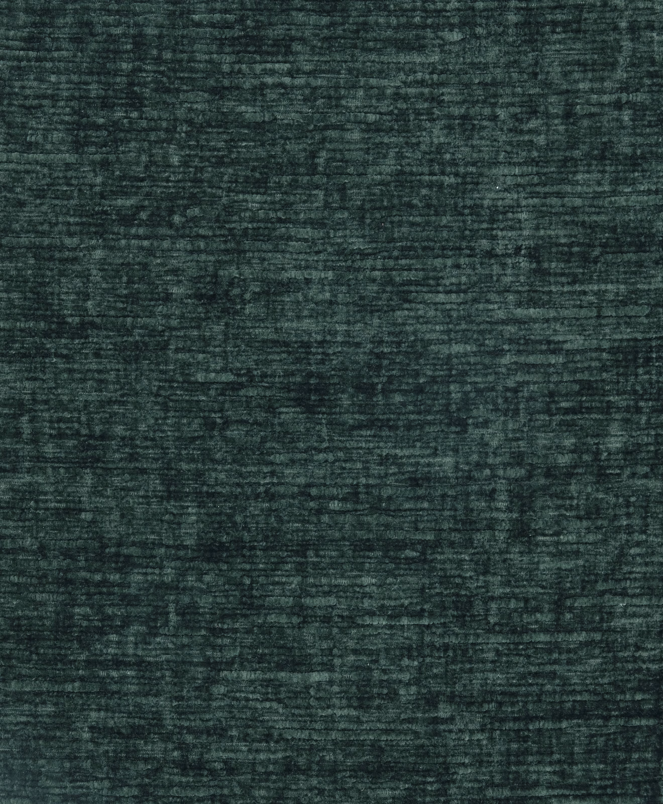 Dark jade green plain fabric with a softly ribbed, velvety texture