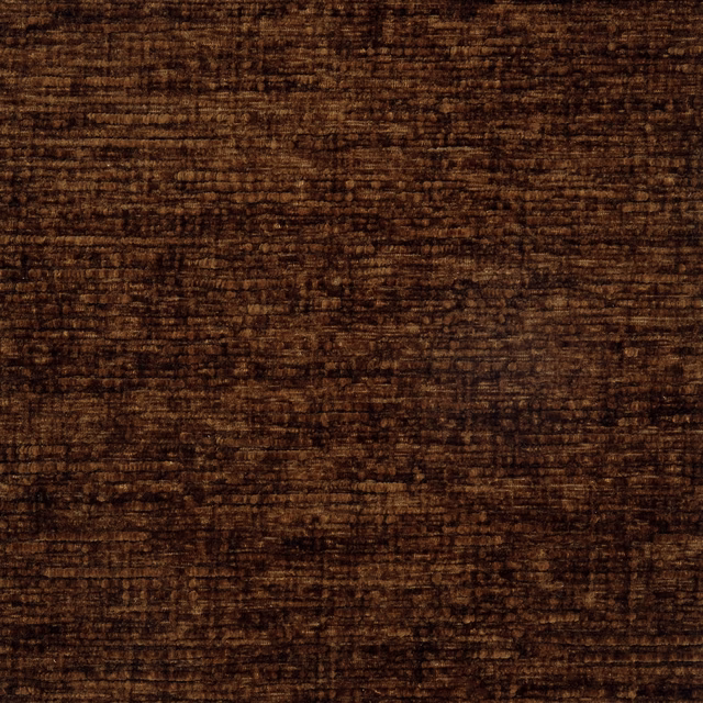 Close-up swatch of deep rust-brown plain fabric with soft velvety texture