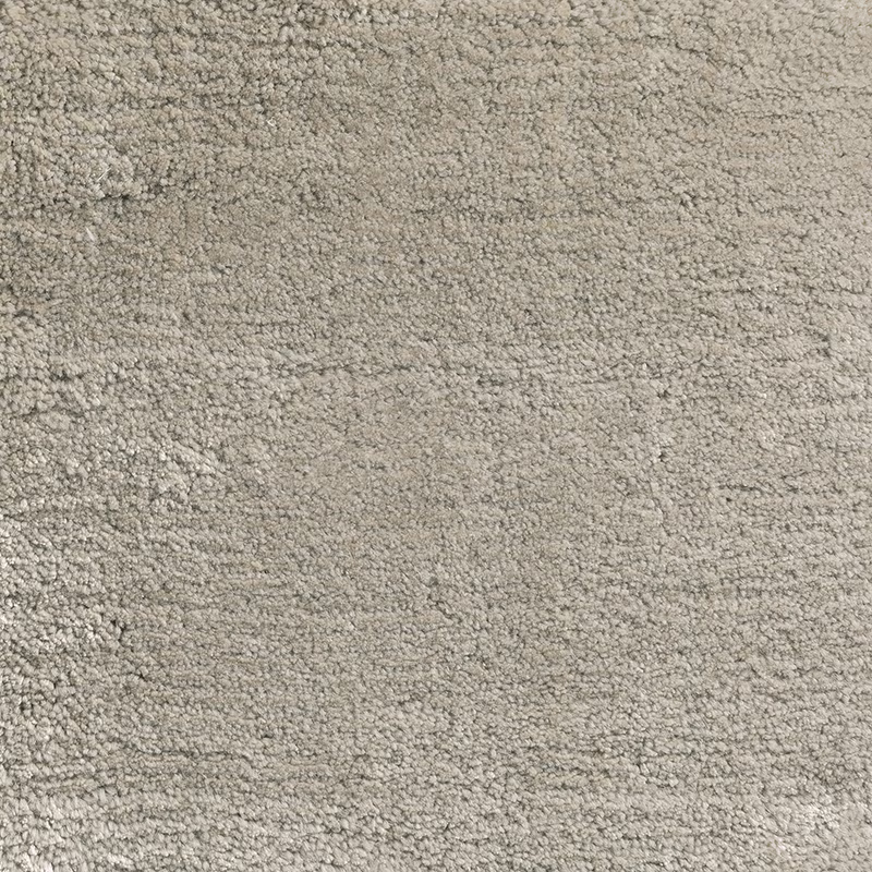 Pale platinum greige carpet with dense looped texture and subtle tonal variation