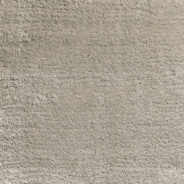 Pale platinum greige carpet with dense looped texture and subtle tonal variation