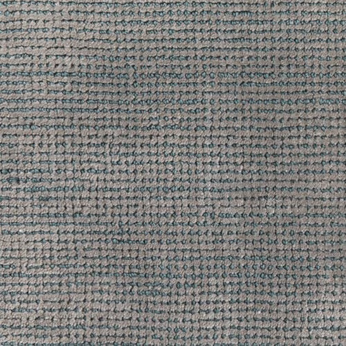 Muted malachite teal and grey woven carpet with dense irregular looped texture