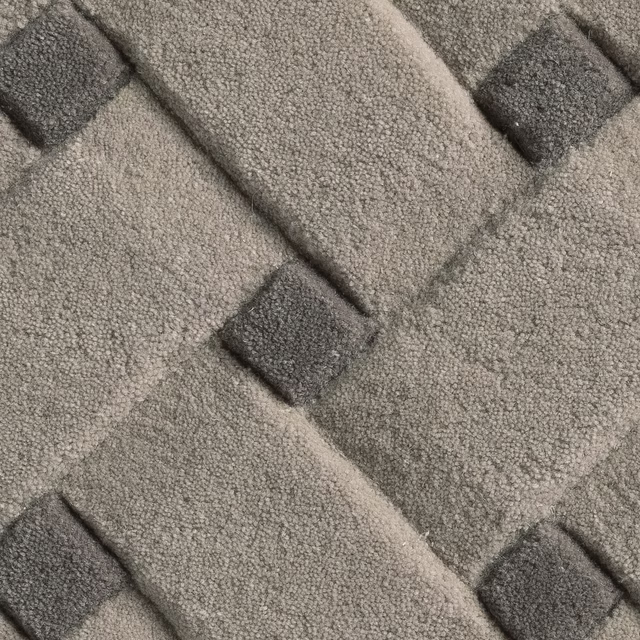 Stone-grey looped texture with charcoal blocks and raised basketweave bands