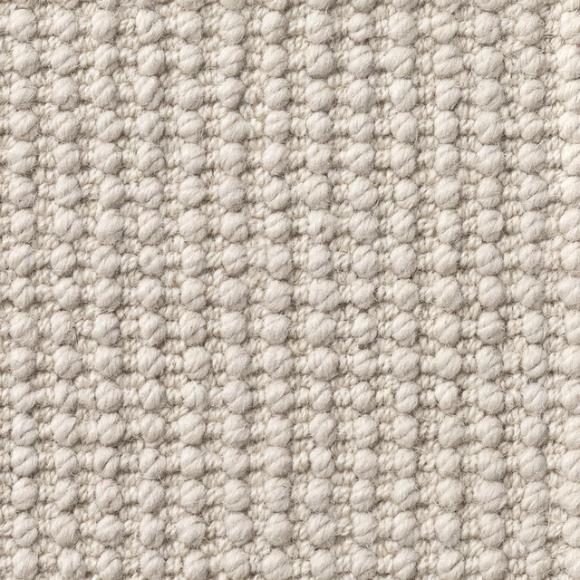 Warm putty nubby texture with ivory and taupe flecks in a close-up swatch