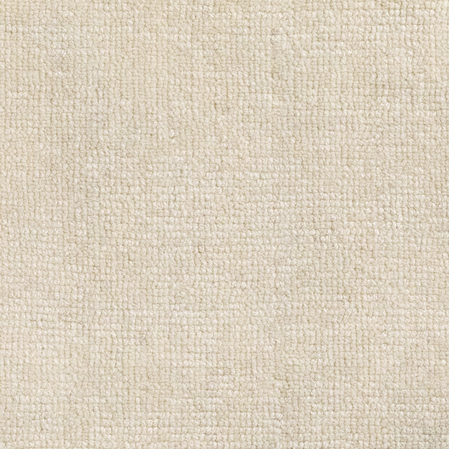 Warm ivory cream textile with a dense, softly pebbled woven surface