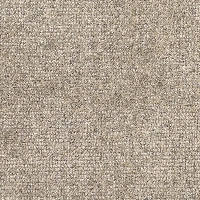 Close-up of warm greige carpet with dense, softly flecked woven texture