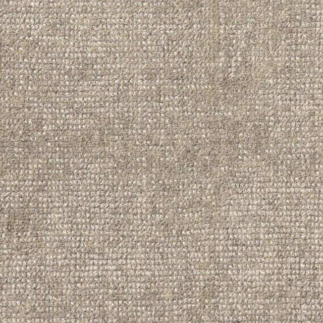 Close-up of warm greige carpet with dense, softly flecked woven texture